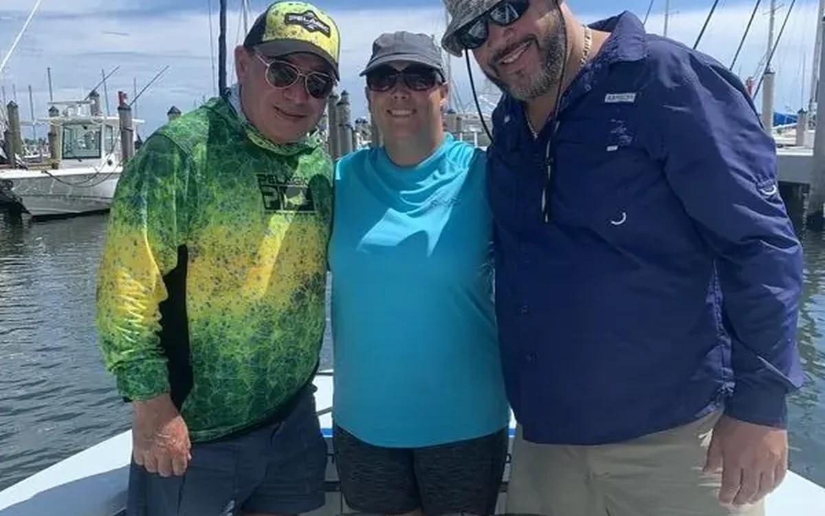 Anglers with a deck full of yellowtail snapper caught on a Miami fishing charter - Nomad Fishing Charters