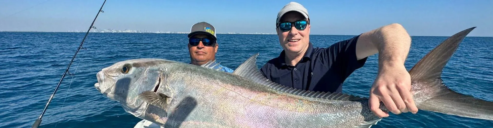 Happy anglers with their catch aboard Nomad Fishing Charters in Miami